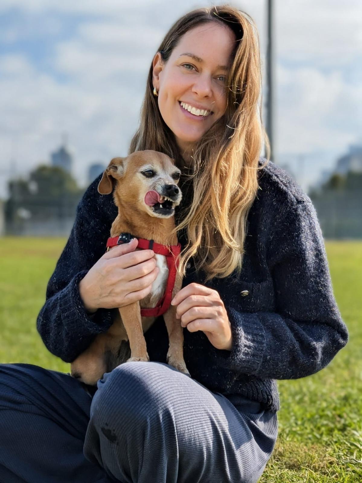 Avital holding Tani in a field