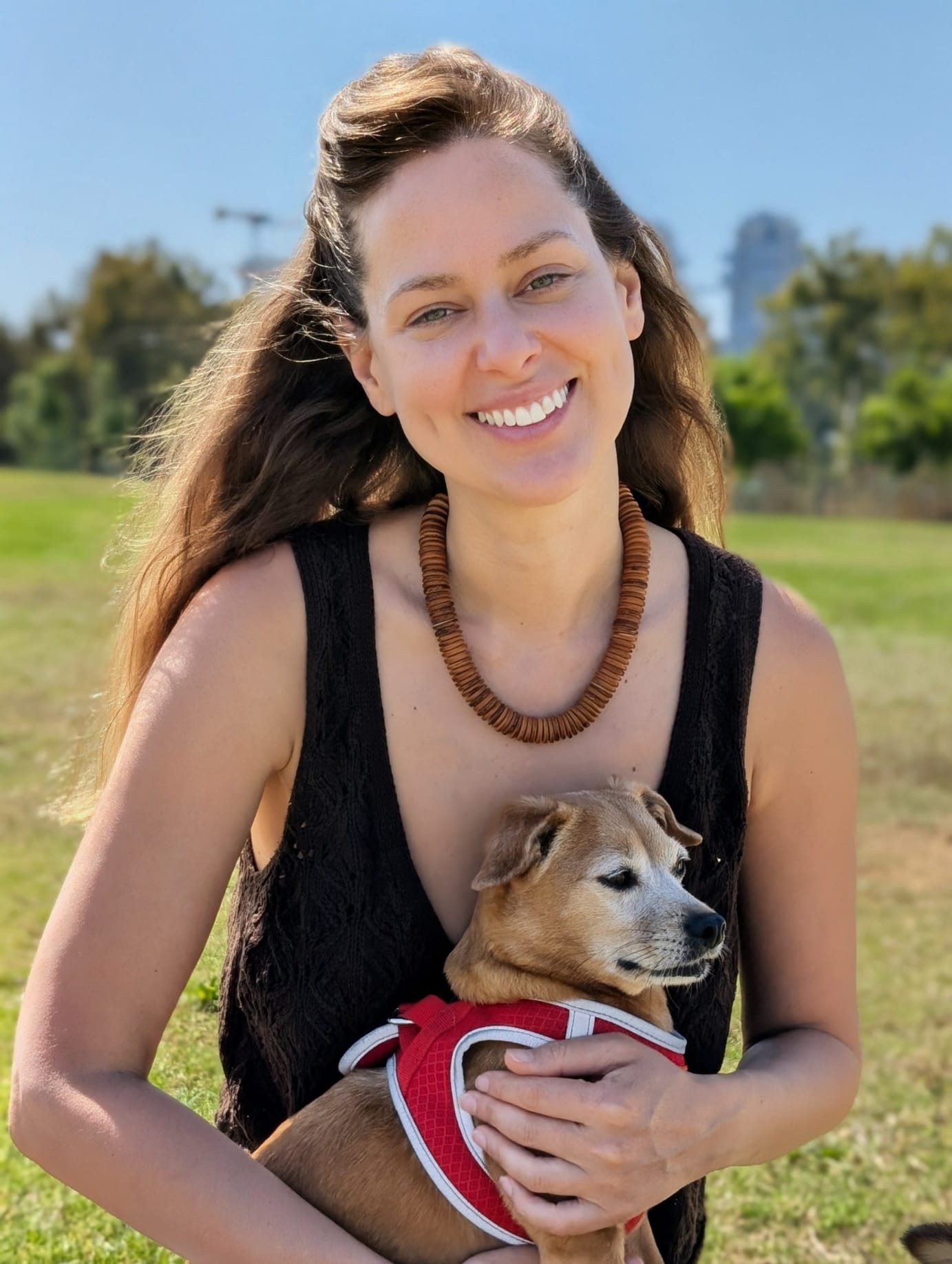 Avital Rien holding Tani in the park